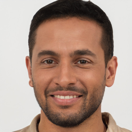 Joyful white young-adult male with short  brown hair and brown eyes