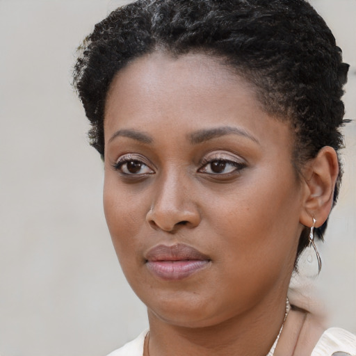 Neutral black young-adult female with short  brown hair and brown eyes