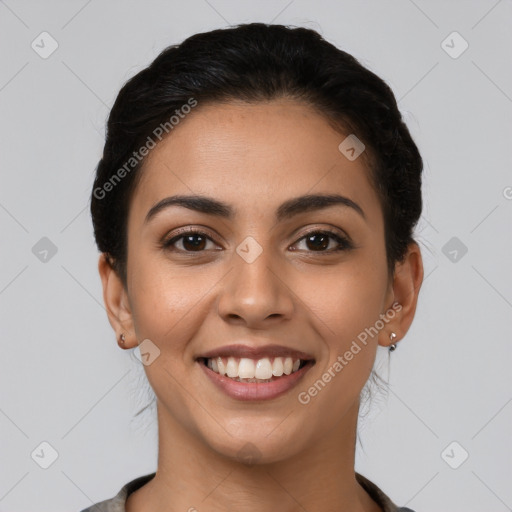 Joyful latino young-adult female with short  brown hair and brown eyes