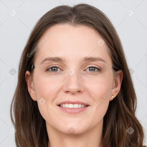 Joyful white young-adult female with long  brown hair and grey eyes