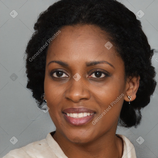 Joyful black young-adult female with short  black hair and brown eyes