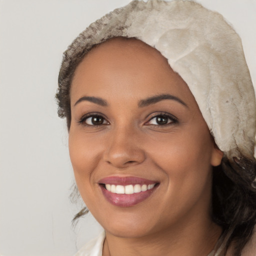 Joyful white young-adult female with long  black hair and brown eyes