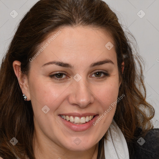 Joyful white adult female with long  brown hair and brown eyes