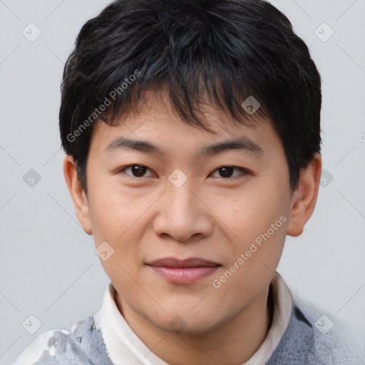 Joyful asian young-adult male with short  brown hair and brown eyes