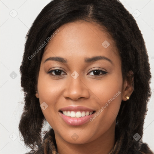 Joyful latino young-adult female with long  brown hair and brown eyes