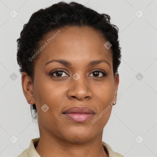 Joyful black young-adult female with short  brown hair and brown eyes