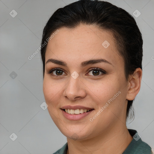 Joyful white young-adult female with short  brown hair and brown eyes