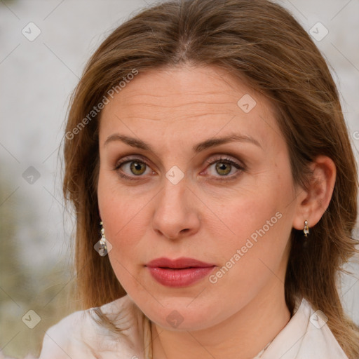 Joyful white adult female with medium  brown hair and brown eyes