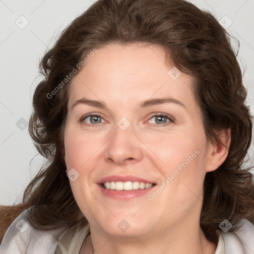 Joyful white young-adult female with medium  brown hair and green eyes