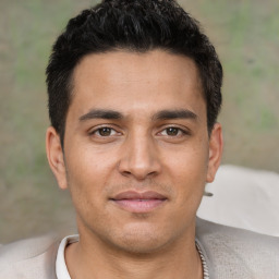 Joyful white young-adult male with short  black hair and brown eyes
