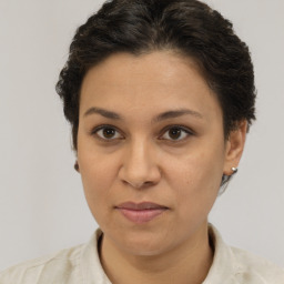 Joyful white adult female with short  brown hair and brown eyes