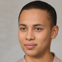 Joyful latino young-adult male with short  brown hair and brown eyes