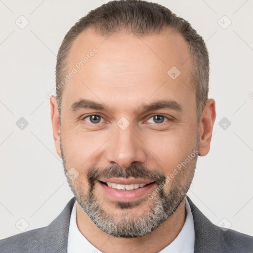 Joyful white adult male with short  brown hair and brown eyes