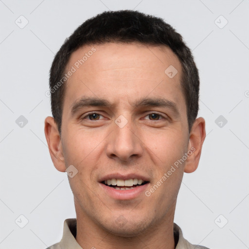 Joyful white young-adult male with short  brown hair and brown eyes