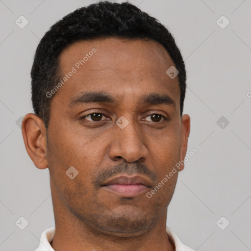 Neutral latino young-adult male with short  brown hair and brown eyes