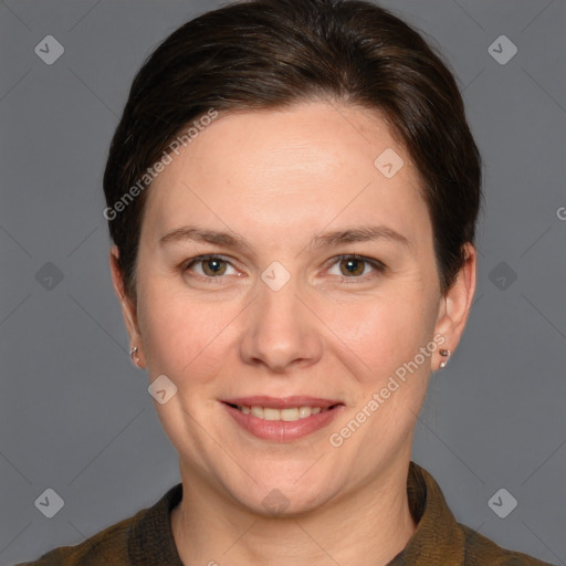 Joyful white adult female with short  brown hair and grey eyes