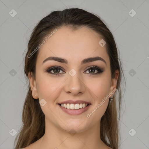 Joyful white young-adult female with long  brown hair and green eyes