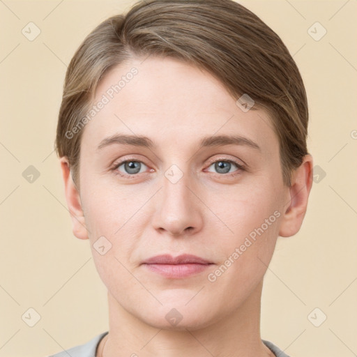 Joyful white young-adult female with short  brown hair and grey eyes