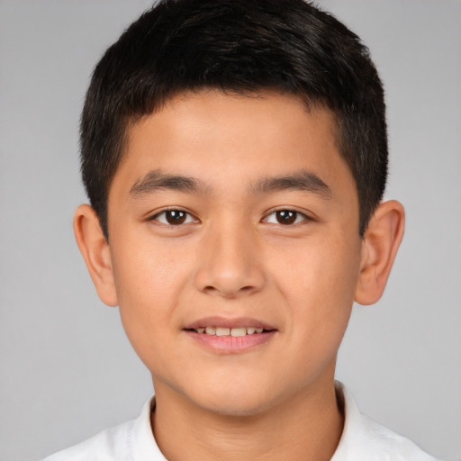 Joyful white child male with short  brown hair and brown eyes