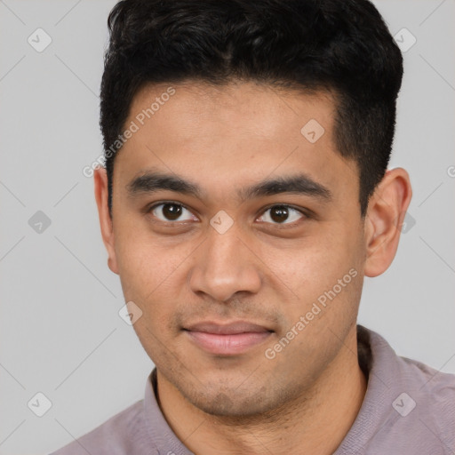 Joyful latino young-adult male with short  black hair and brown eyes