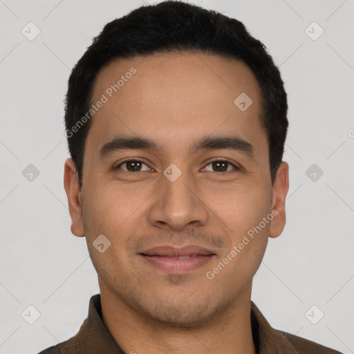 Joyful latino young-adult male with short  black hair and brown eyes