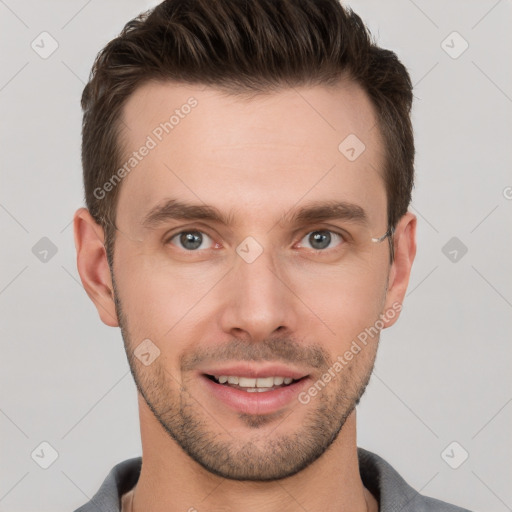 Joyful white young-adult male with short  brown hair and grey eyes