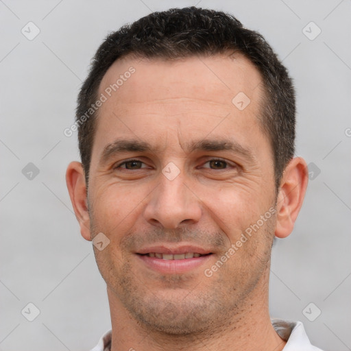 Joyful white adult male with short  brown hair and brown eyes