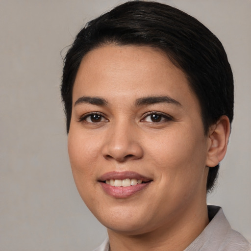 Joyful white young-adult female with short  black hair and brown eyes