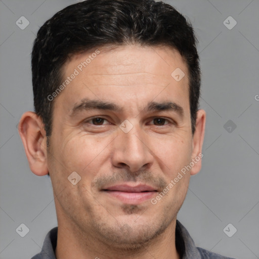 Joyful white adult male with short  brown hair and brown eyes