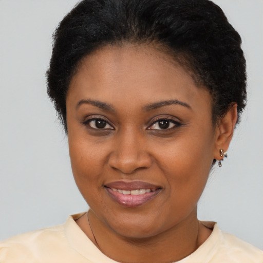 Joyful latino young-adult female with short  brown hair and brown eyes