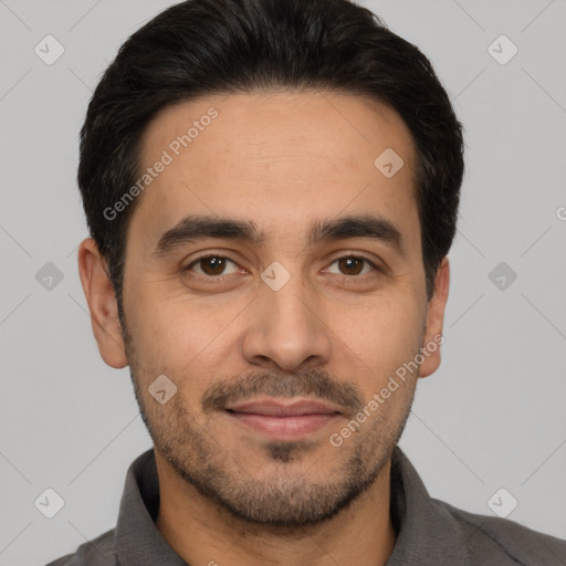 Joyful white young-adult male with short  black hair and brown eyes