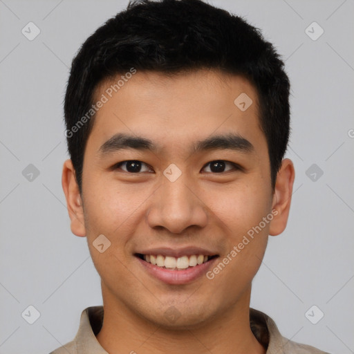 Joyful asian young-adult male with short  black hair and brown eyes