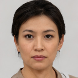 Neutral asian young-adult female with medium  brown hair and brown eyes