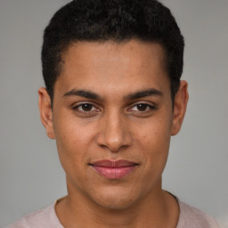 Joyful latino young-adult male with short  brown hair and brown eyes