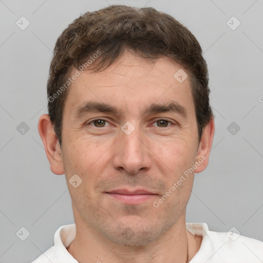 Joyful white adult male with short  brown hair and brown eyes