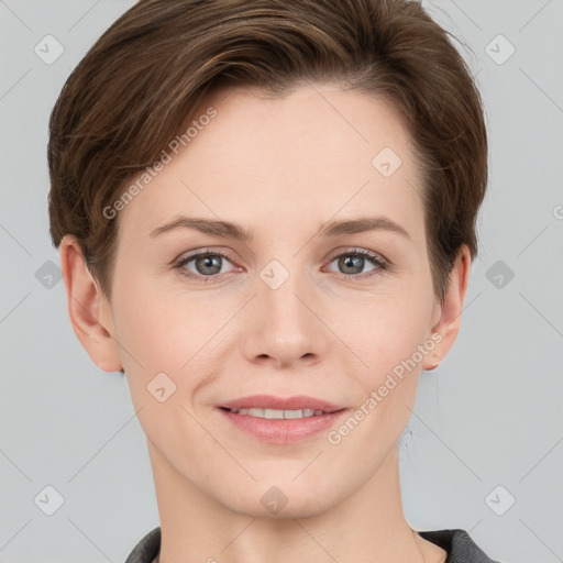 Joyful white young-adult female with short  brown hair and grey eyes