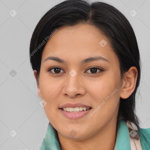 Joyful asian young-adult female with medium  brown hair and brown eyes