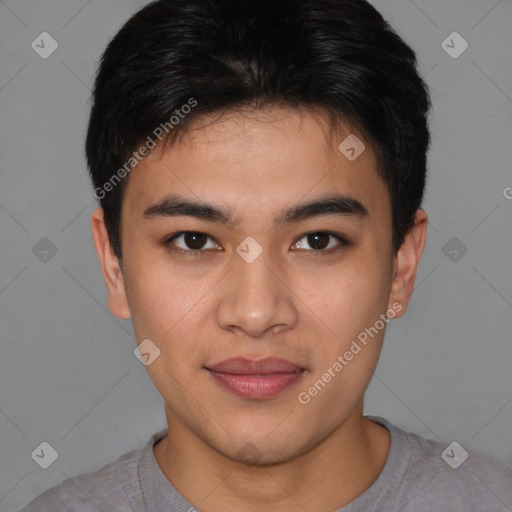 Joyful asian young-adult male with short  brown hair and brown eyes