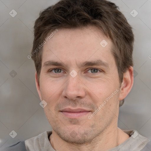 Joyful white adult male with short  brown hair and grey eyes