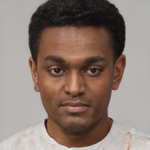 Neutral black young-adult male with short  black hair and brown eyes