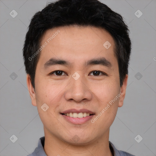 Joyful asian young-adult male with short  black hair and brown eyes