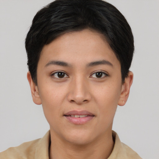 Joyful asian young-adult female with short  brown hair and brown eyes