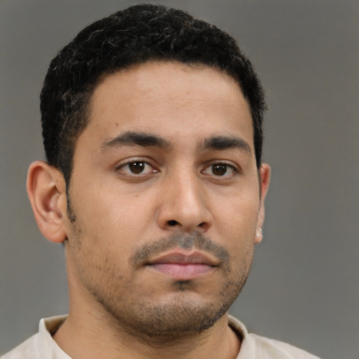 Neutral latino young-adult male with short  brown hair and brown eyes