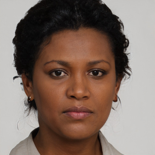 Neutral black young-adult female with short  brown hair and brown eyes
