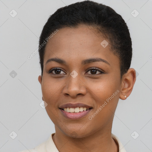 Joyful black young-adult female with short  brown hair and brown eyes