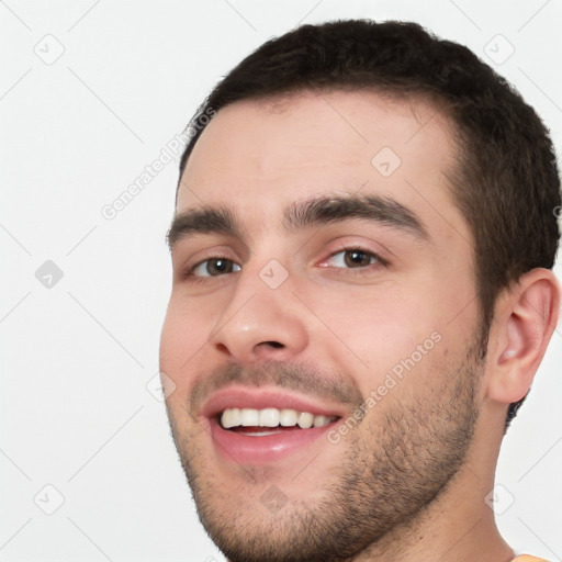 Joyful white young-adult male with short  black hair and brown eyes