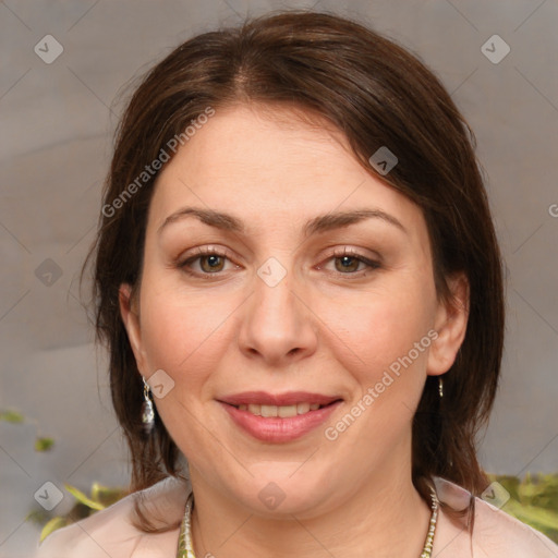 Joyful white adult female with medium  brown hair and brown eyes