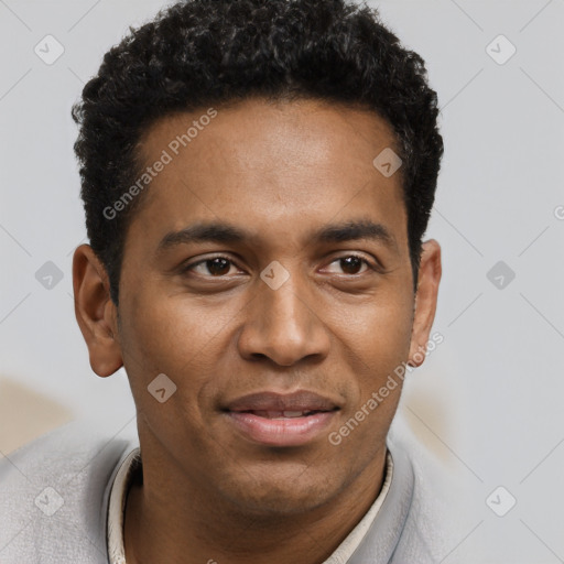 Joyful black young-adult male with short  black hair and brown eyes