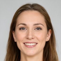 Joyful white young-adult female with long  brown hair and grey eyes