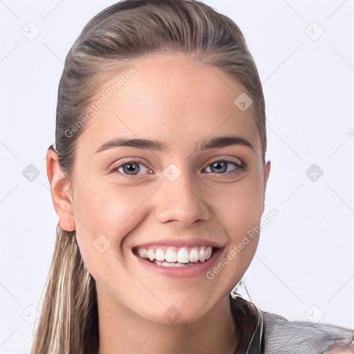 Joyful white young-adult female with long  brown hair and blue eyes